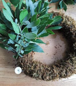 foliage being added to wreath
